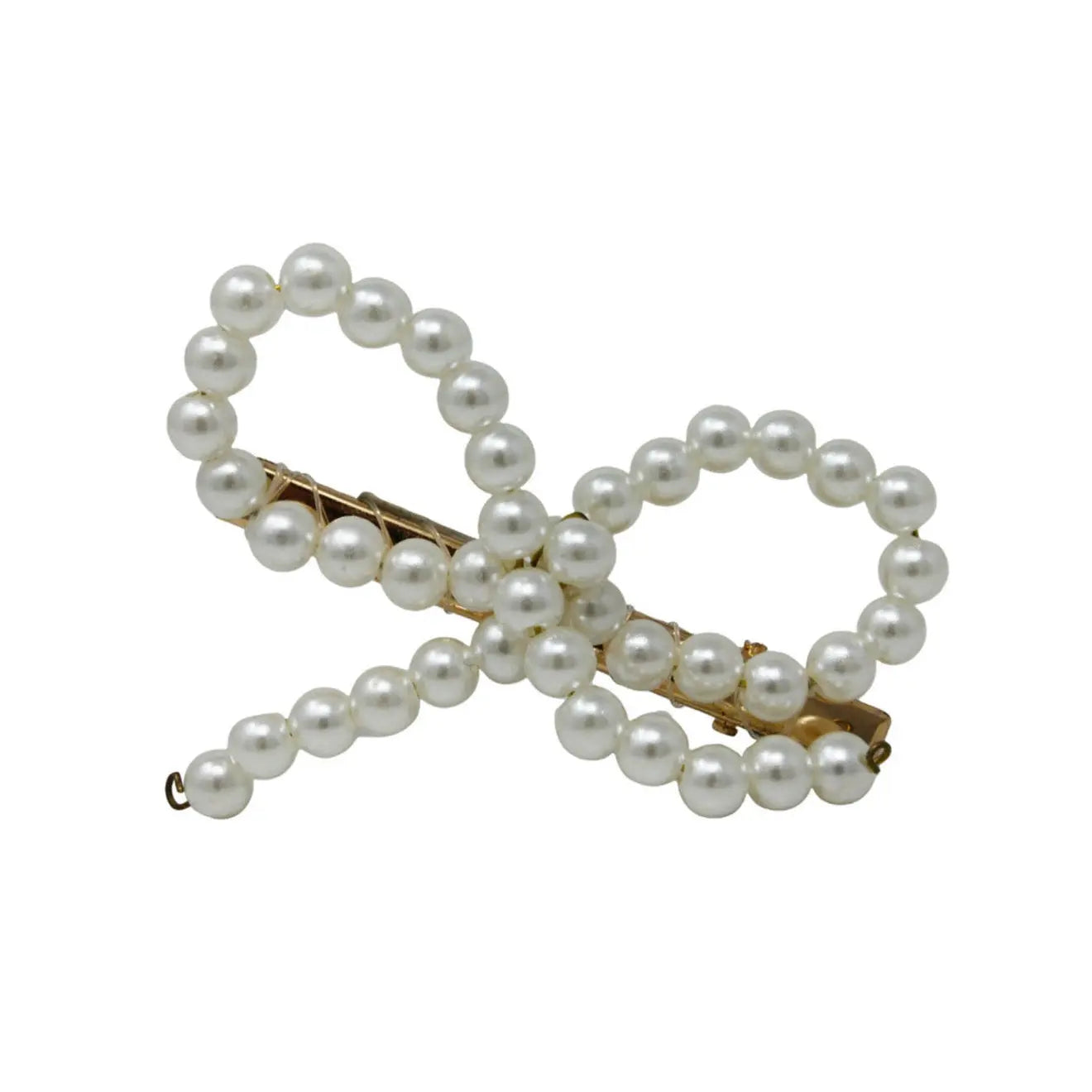 Pearl bow with tails on a golden coloured clip. Cute Cute