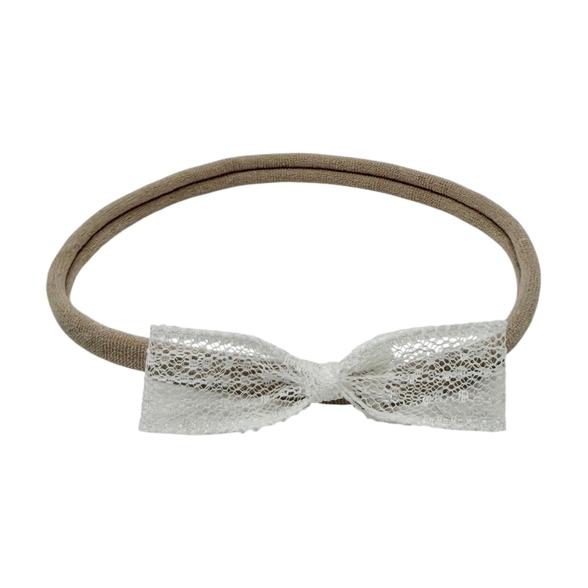 Delicate lace bow on a skinny soft nylon headband