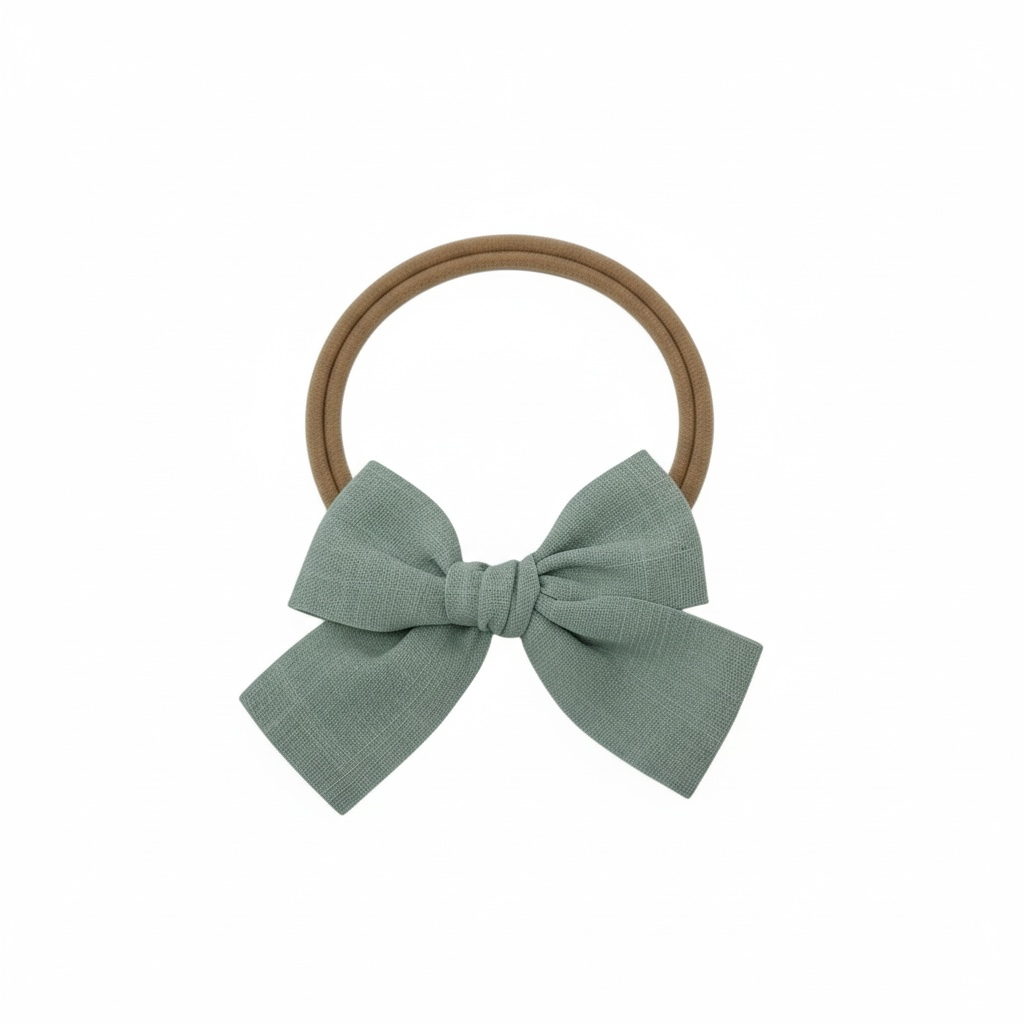 Green fabric bow on a headband