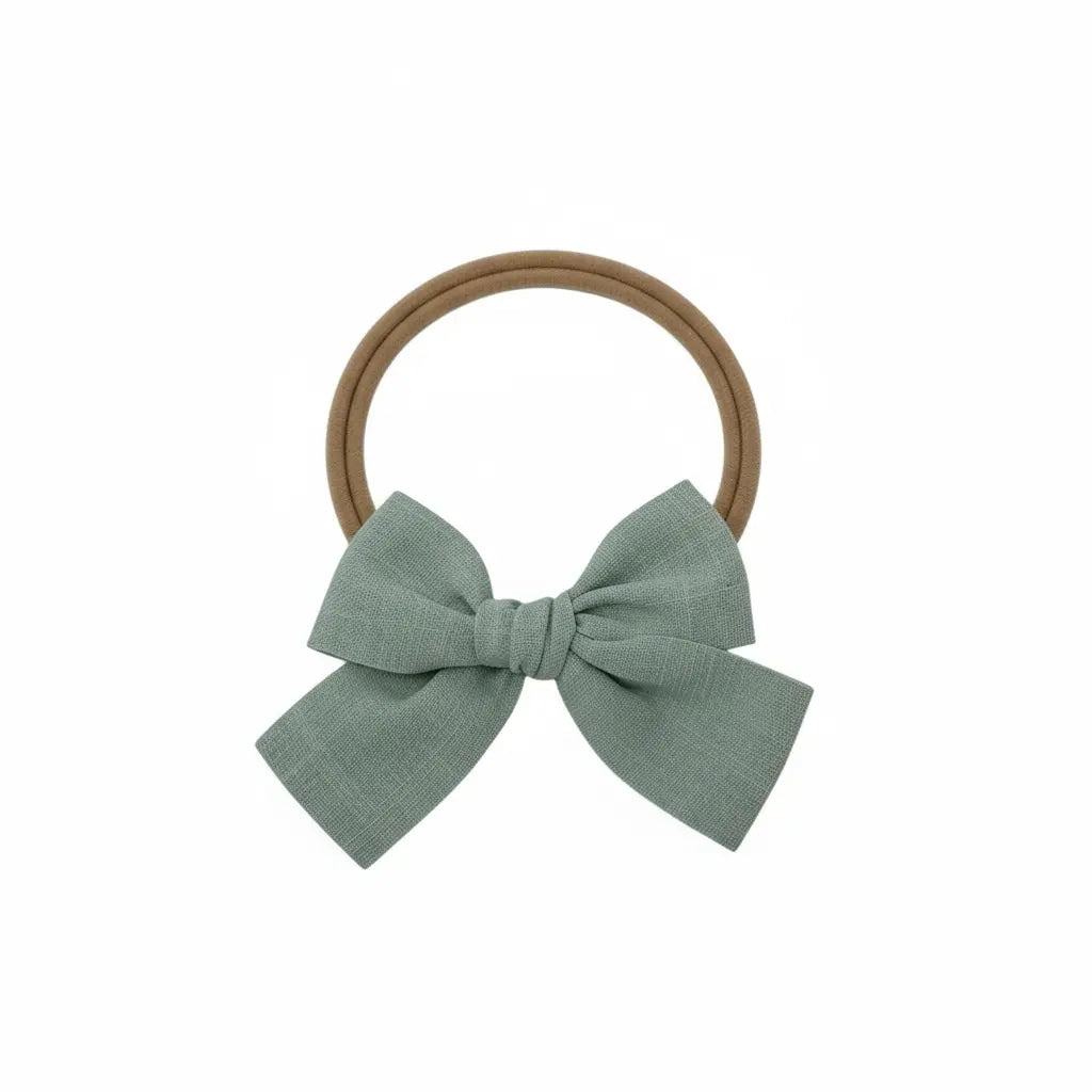Green fabric bow on a headband Cute Cute