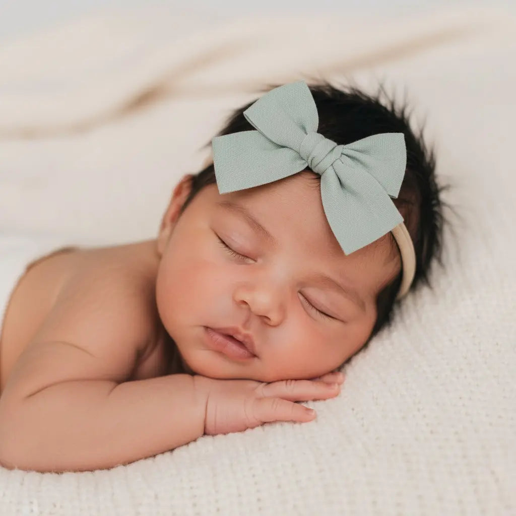 Green fabric bow on a headband Cute Cute
