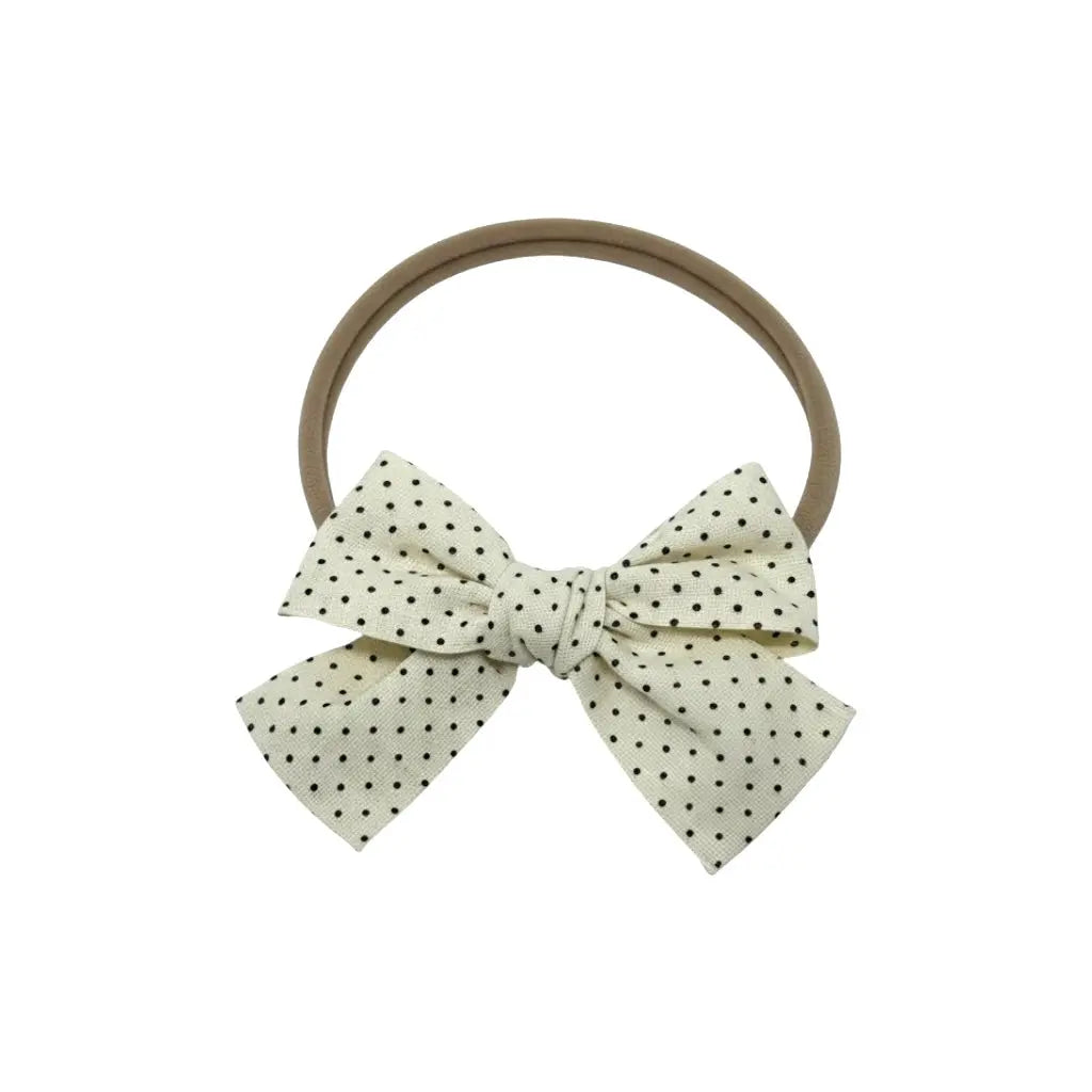 Small polka dot fabric bow on a headband Cute Cute