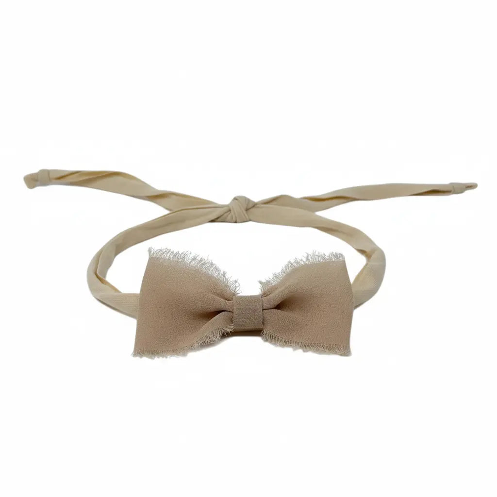 Frayed chiffon bow on an ivory tie back Cute Cute