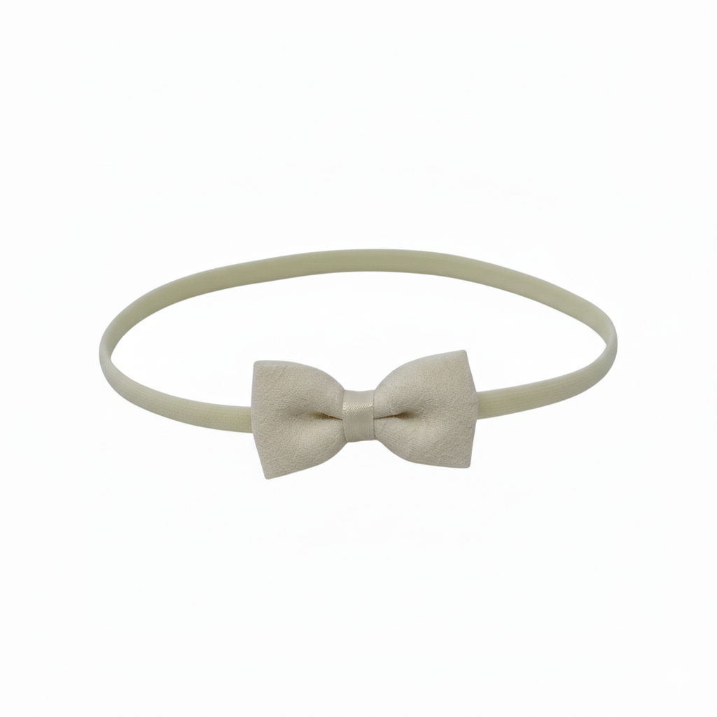 Ivory fabric bow on a headband