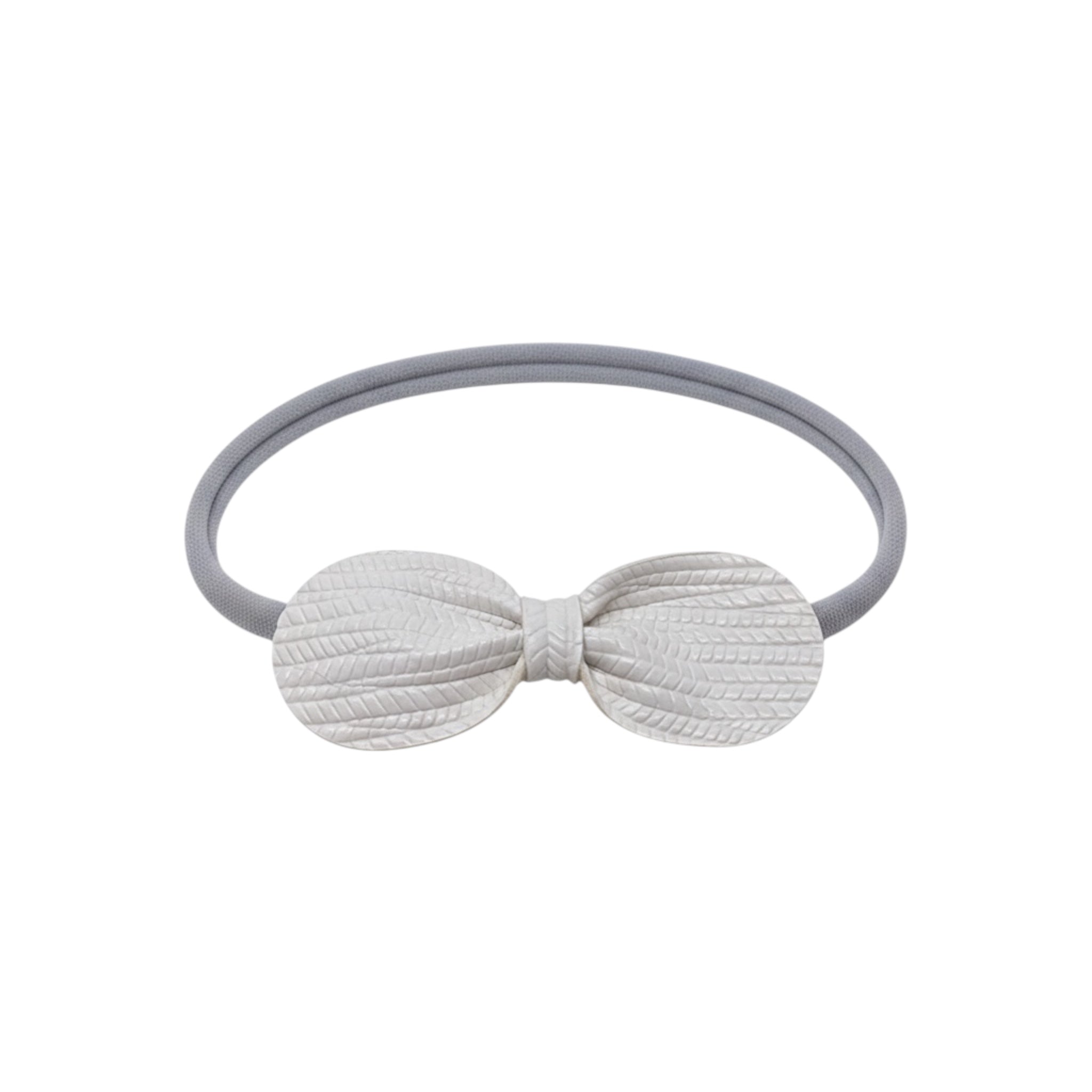 Faux leather textured off white bow on a gray elastic headband