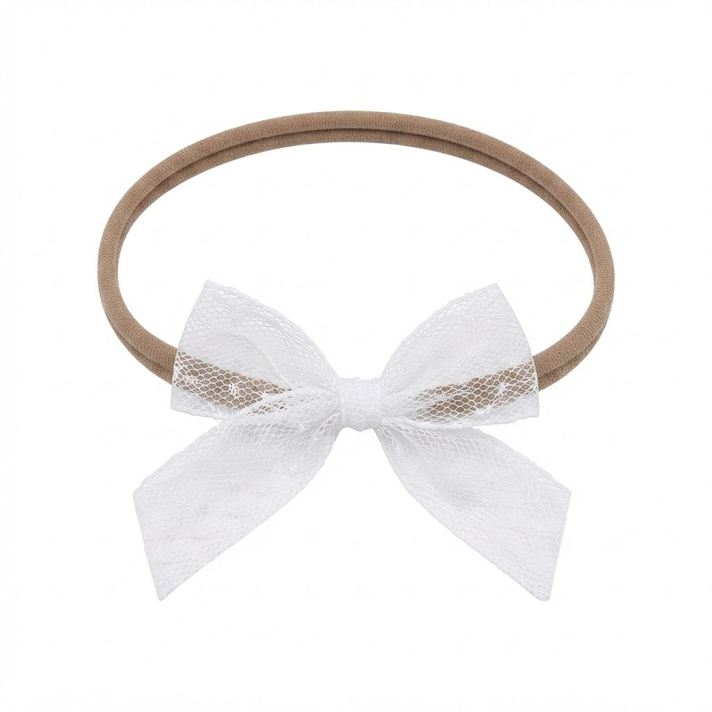 White lace bow on a skinny soft nylon headband