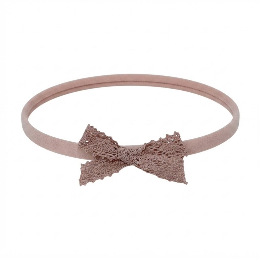 Dusky pink lace bow on a soft elastic headband