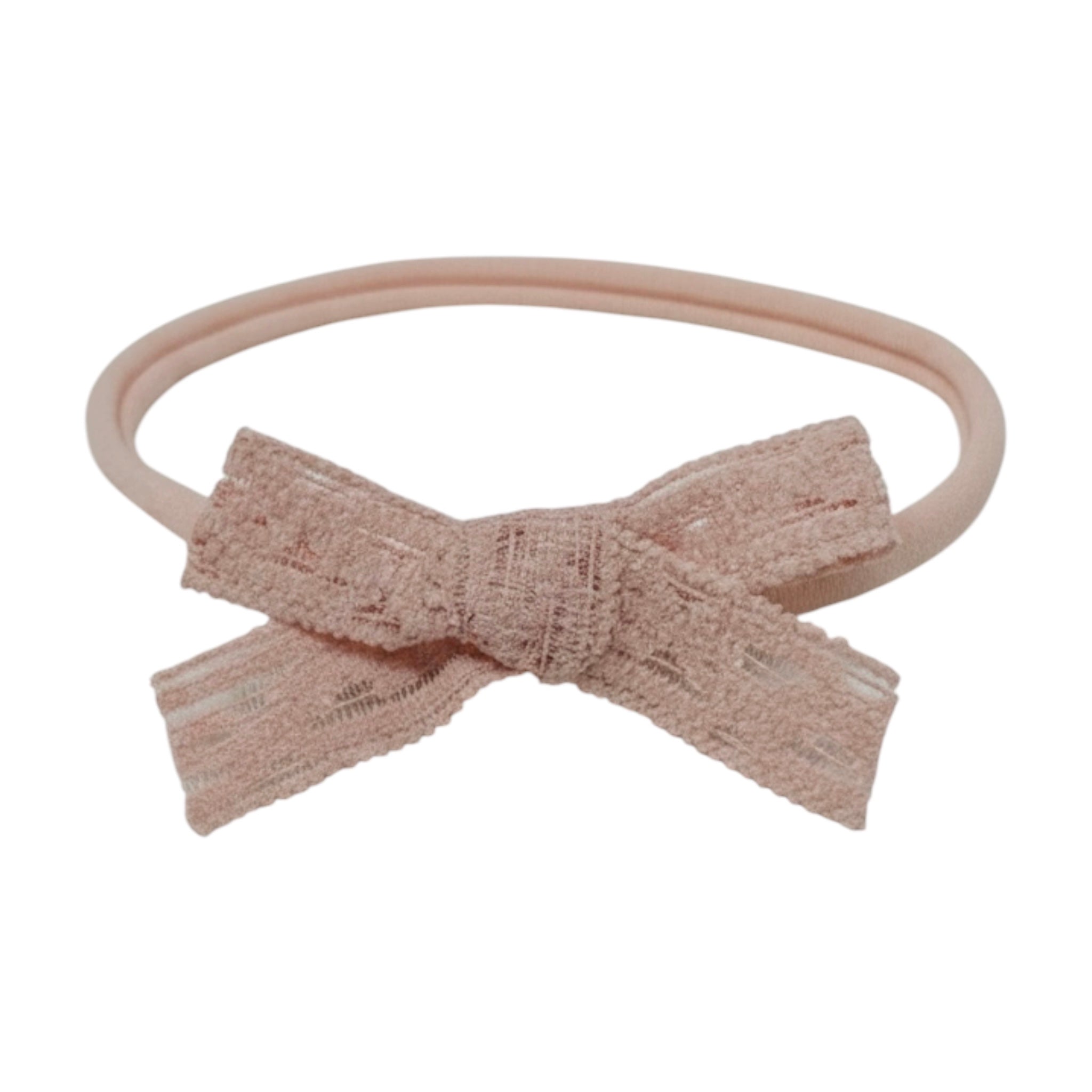 Blush pink lace bow on a skinny soft nylon headband