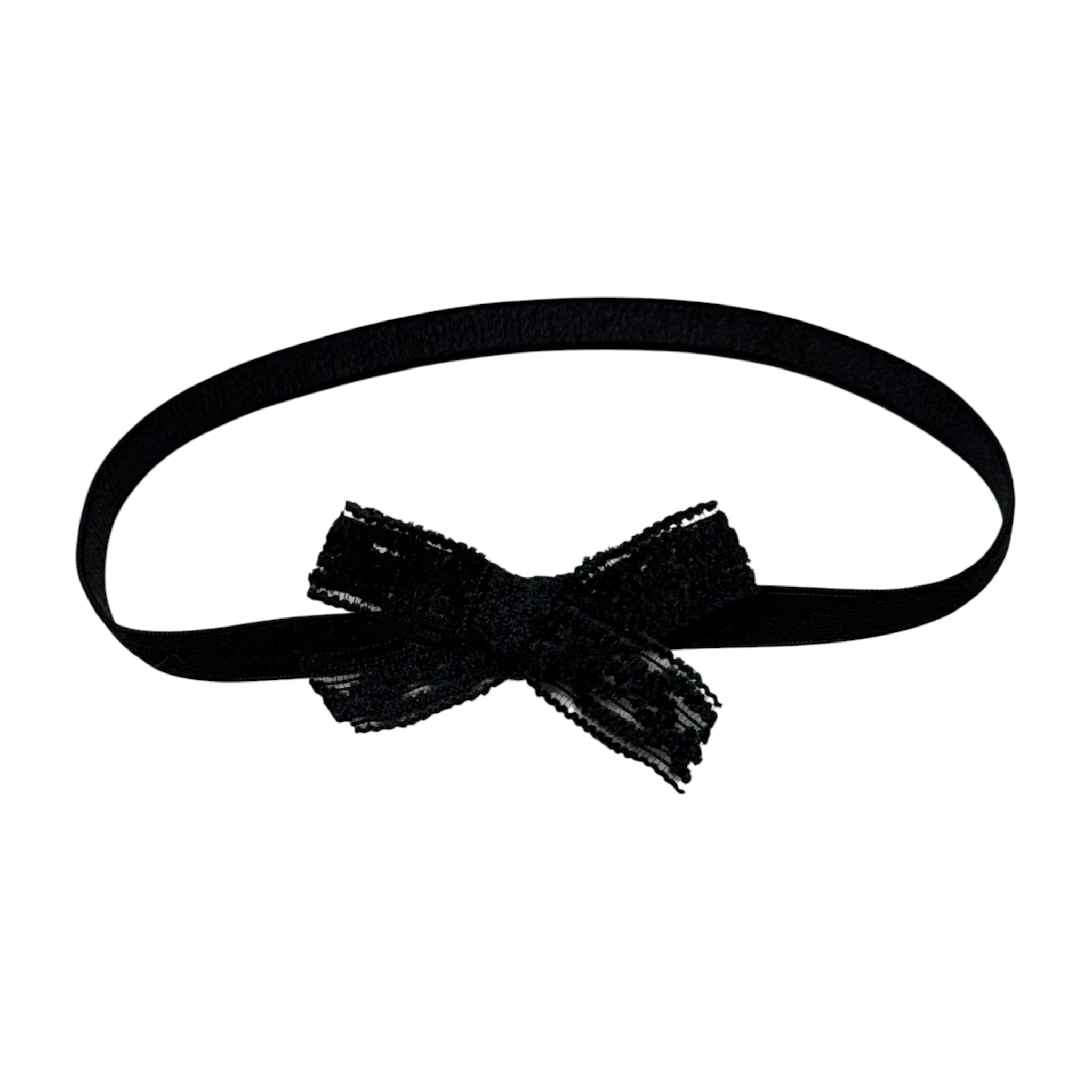Black lace bow on a soft headband