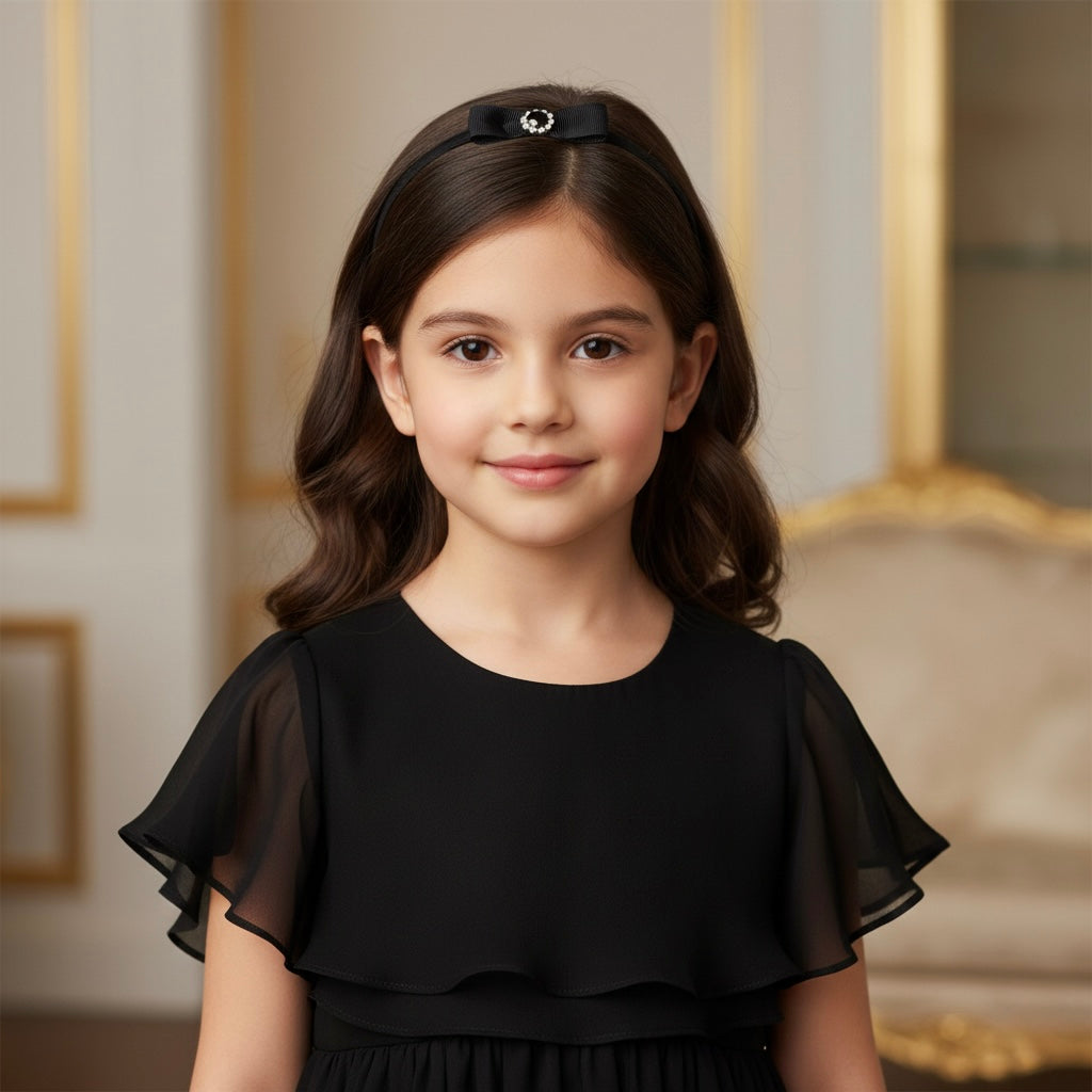 Black single bow with rhinestone on a headband