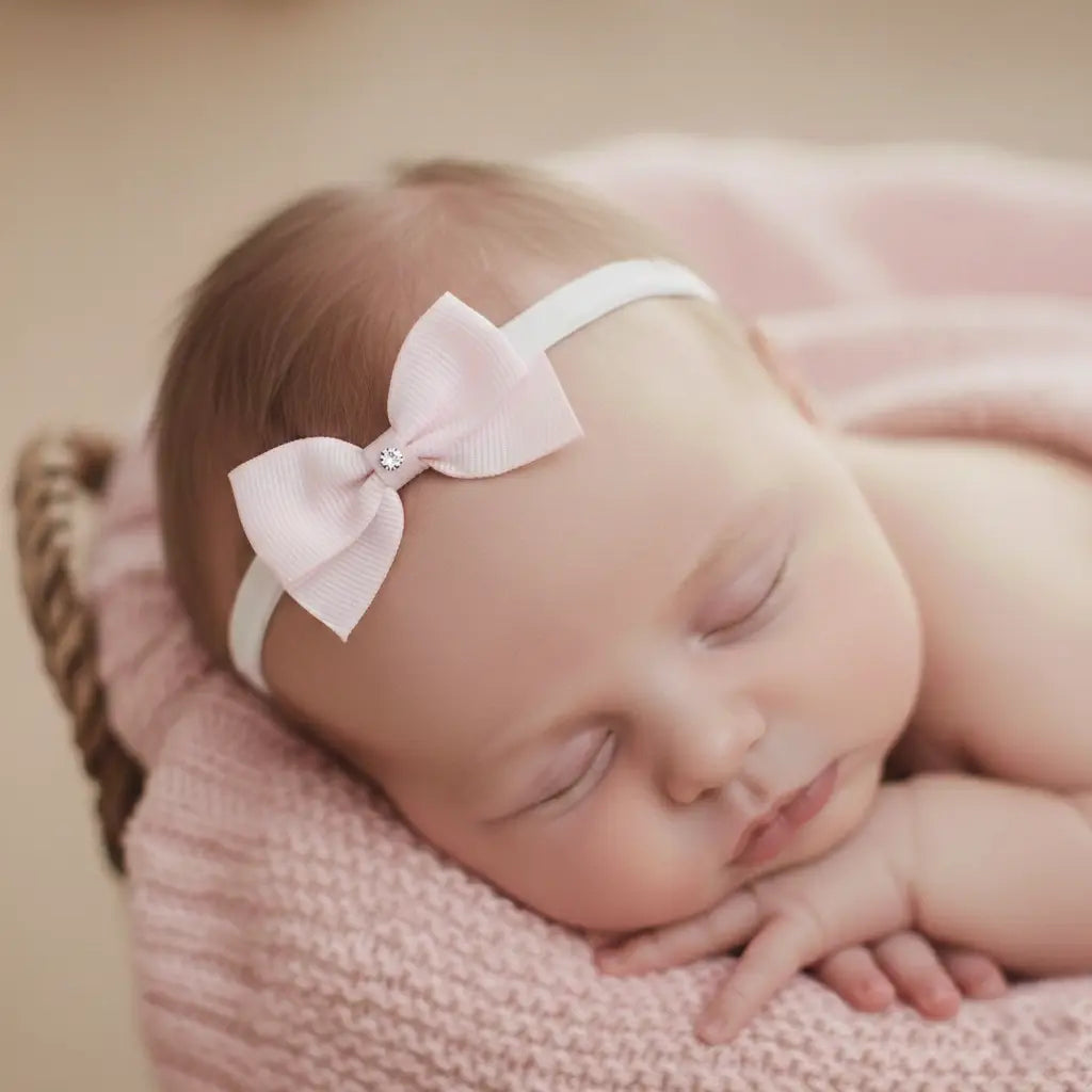Small pink bow with tails on a soft elastic headband Cute Cute