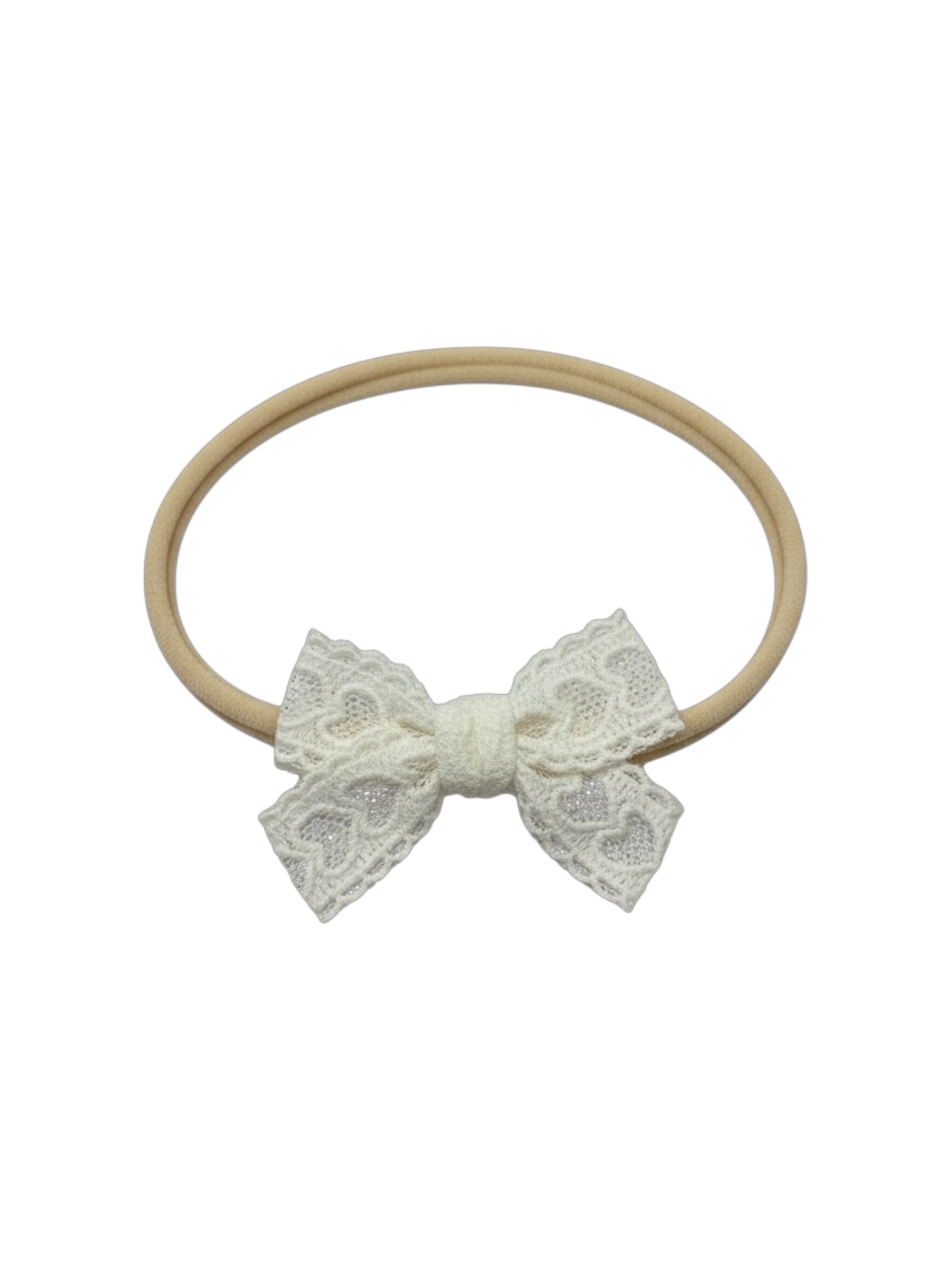 White lace bow on an ivory nylon headband