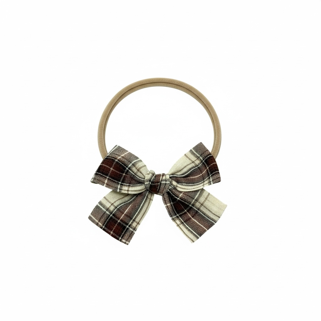 Brown fabric checked bow on a headband
