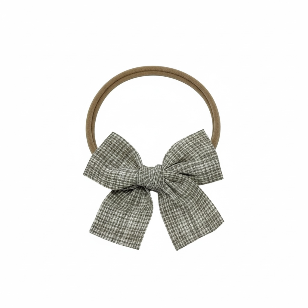 Checked brown fabric bow on a headband