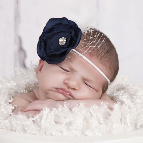 Layered navy satin flower with rhinestone, feather and net on a soft elastic headband