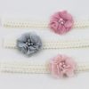 Delicate headband with flower in light pink with pearls and stones