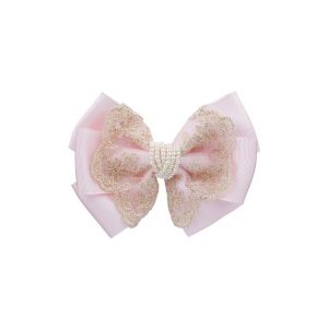 Oversized pink and gold bow with pearls on a clip