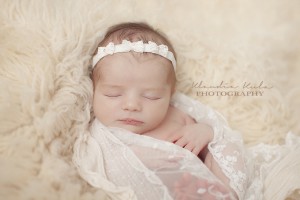 Off white headband with three lace bows decorated with pearl and stones
