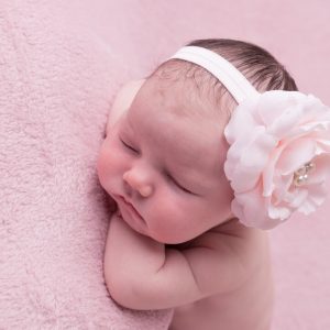 Pink rose with rhinestone on a soft elastic headband