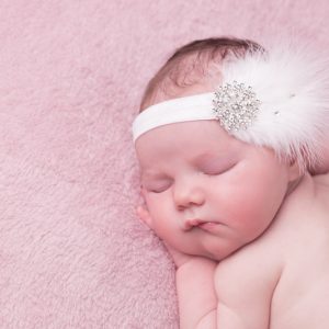 White feather headband with large rhinestone and Swarovski diamante