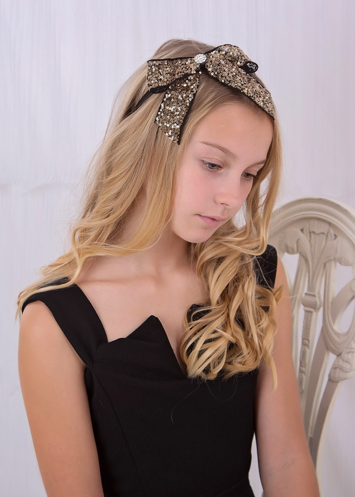 Gold and black sequin bow with rhinestone on Alice Band